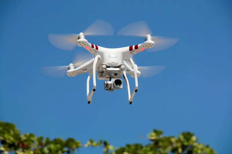 FAA certified drone pilot operating professional aerial photography equipment in Indiana